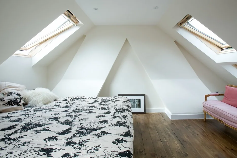 Bright loft bedroom conversion with roof windows in both roof slopes