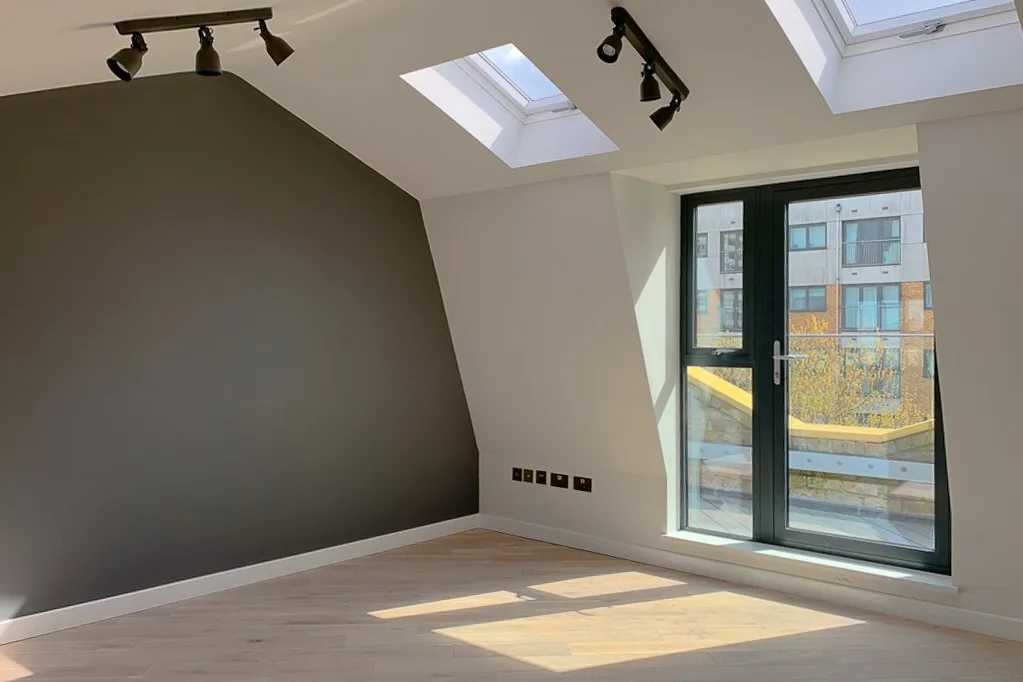 Finished loft conversion in Bromley with French doors onto a Juliet balcony