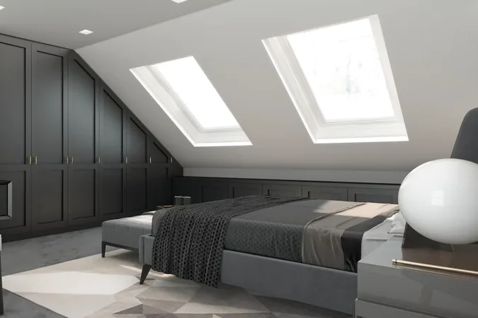 Loft bedroom with fitted eaves storage and twin roof windows